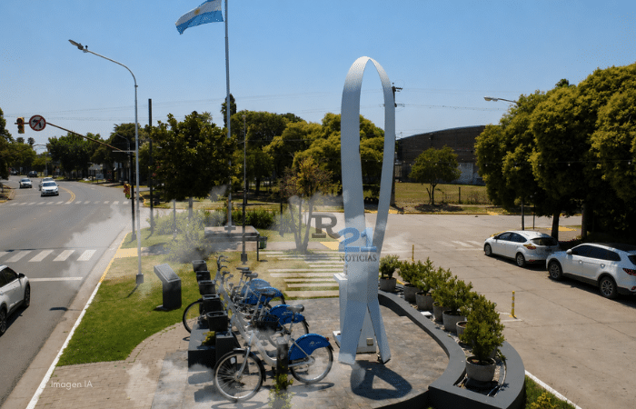 Vista aérea del ingreso a Pueblo Esther intervenida con bicicletas públicas, en representación del proyecto aprobado por el Concejo Deliberante para implementar un sistema de movilidad sustentable.